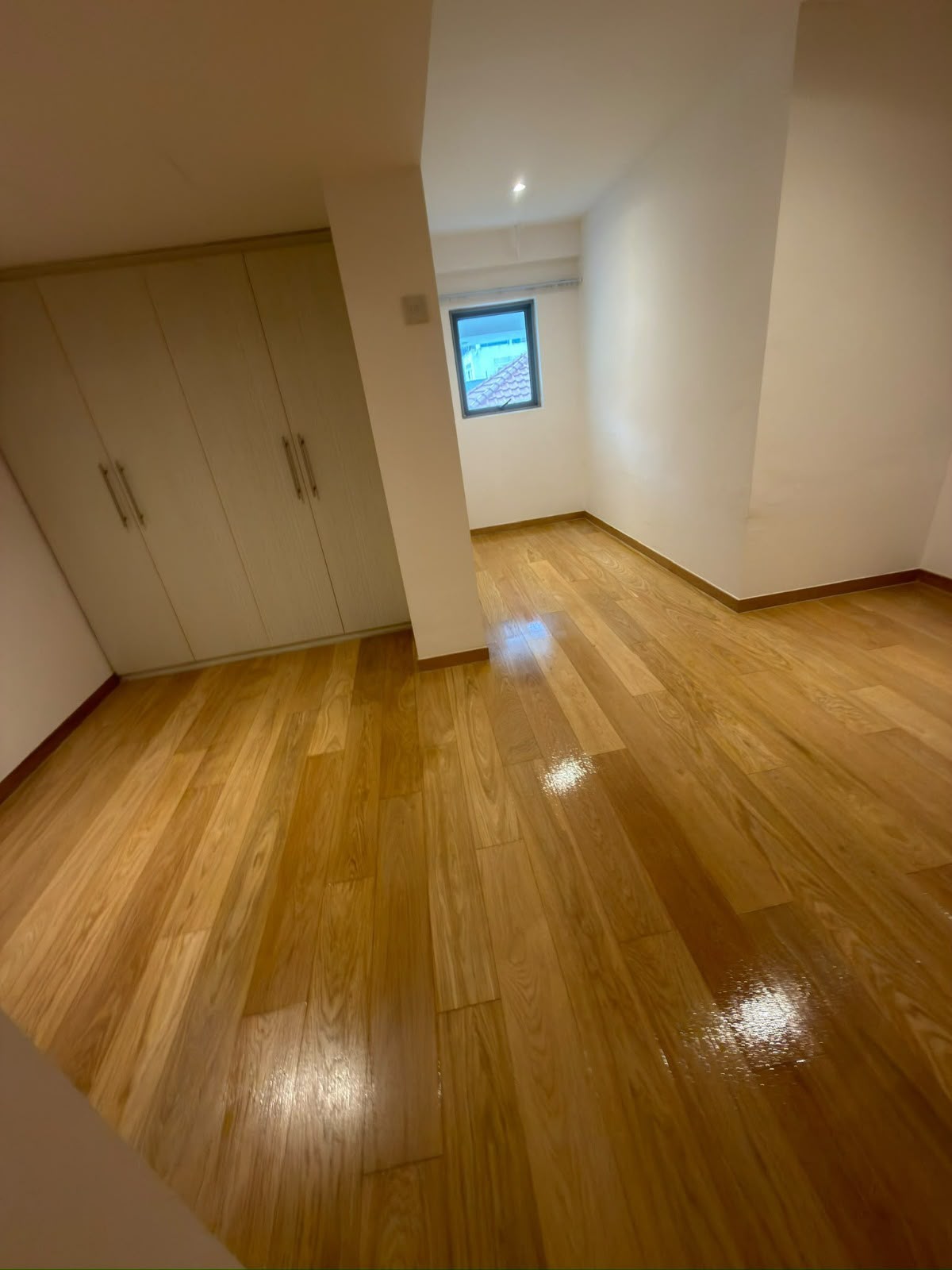 Wood flooring around the wardrobe area at Seraya Lane